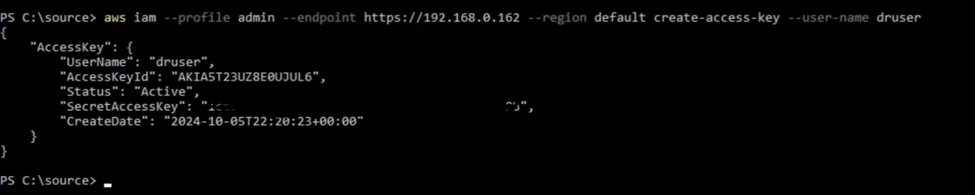 PowerShell window displaying the result of the 'aws iam create-access-key' command for the user 'druser'. The output shows the generated access key ID, secret access key, and the creation date for the access key.